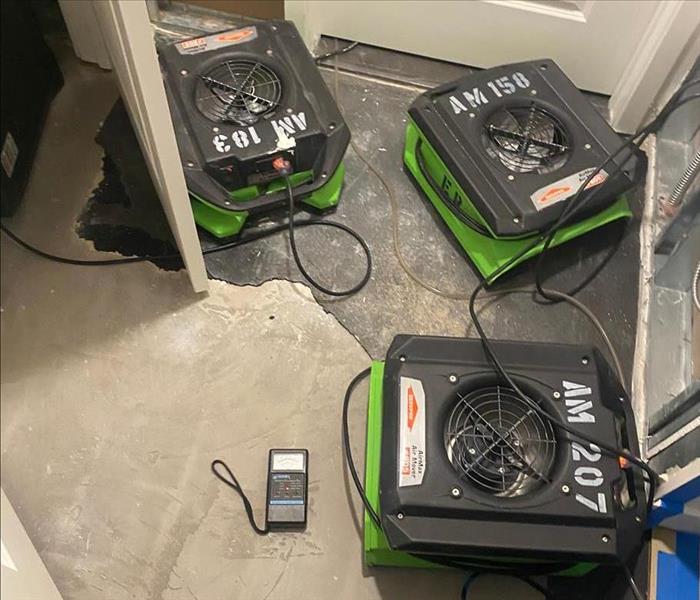 SERVPRO equipment in a small area of a home.
